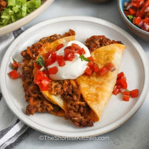 plated Baked Tacos with sour cream on a plate
