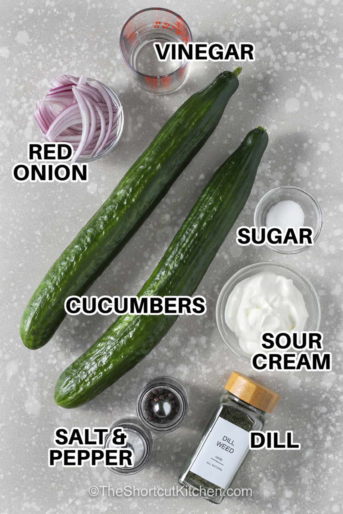 vinegar , red onion , cucumbers , sugar , sour cream , dill ,salt and pepper with labels to make Creamy Cucumber Salad Recipe