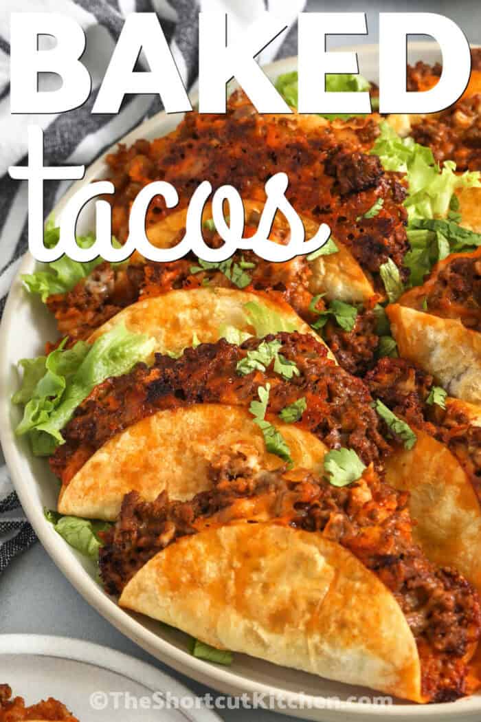 Make oven baked tacos with ground beef, taco seasoning, salsa, and melty cheese for a quick family dinner. Flour tortillas are folded and baked between hot sheet pans to create the best crispy texture. Serve them with fresh toppings like shredded lettuce, tomatoes, sour cream, guacamole, and pico de gallo for an easy weeknight meal. Pin this easy dinner idea for later. #theshortcutkitchen close up of Baked Tacos on a plate with a title