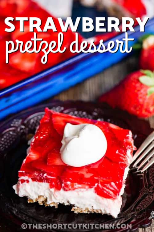 Make strawberry pretzel dessert for a sweet and salty treat that combines crushed pretzels, cream cheese, whipped topping, and fresh strawberries. This classic strawberry pretzel dessert recipe is baked for the crust, then chilled until set. It is a great shortcut dessert for Easter, Mother’s Day, summer cookouts, or any party where you need an easy 9x13 dessert. #thehsortcutkitchen A slice of strawberry pretzel dessert with a title