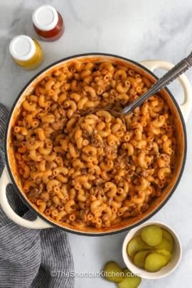 creamy One Pot CheeseBurger Pasta in the pot with a spoon