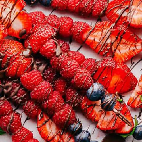 close up of Fruit Kabobs with melted chocolate drizzled on top