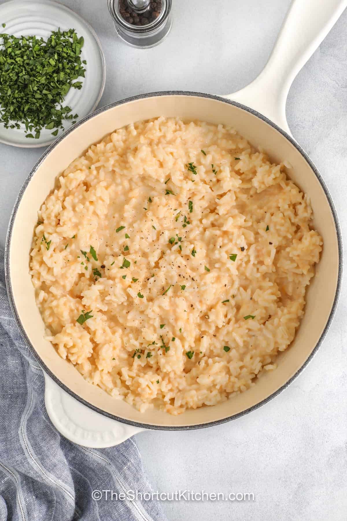 Cheesy rice makes every dinner a little more comforting and satisfying. This easy side dish is made with simple ingredients and has plenty of creamy, cheesy flavor. It pairs perfectly with chicken, pork chops, meatloaf, or grilled steak. Kids and adults both love this family favorite, making it a great choice for busy weeknights or cozy Sunday dinners. Keep this homemade rice recipe on your menu when you need an easy side everyone enjoys. #theshortcutkitchen Cheesy Rice in a pot