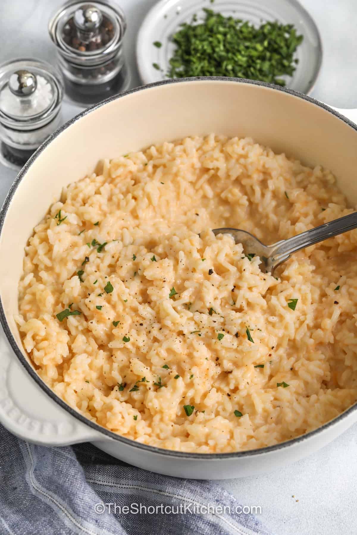 When dinner needs cheesy rice, this recipe delivers big flavor with little effort. Creamy and comforting, this easy side dish is made with simple ingredients and pairs with almost any main course. Serve it with roast chicken, meatloaf, or grilled pork for a meal everyone will love. It is a family favorite that belongs in every recipe collection. Add it to your menu tonight. #theshortcutkitchen creamy Cheesy Rice in the pot