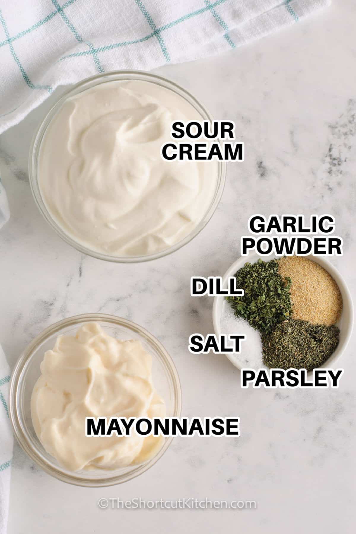 This homemade chip dip is a creamy no-cook appetizer made with sour cream, mayonnaise, dried dill, parsley, and garlic powder. It takes just 5 minutes to stir together and tastes even better after chilling. Serve this easy chip dip recipe cold with potato chips, crackers, pretzels, or fresh vegetables for parties, game day, movie night, or quick snacking. Save this recipe for your next snack tray. #theshortcutkitchen sour cream , mayonnaise , garlic powder , dill ,salt , parsley with labels to make Homemade Chip Dip