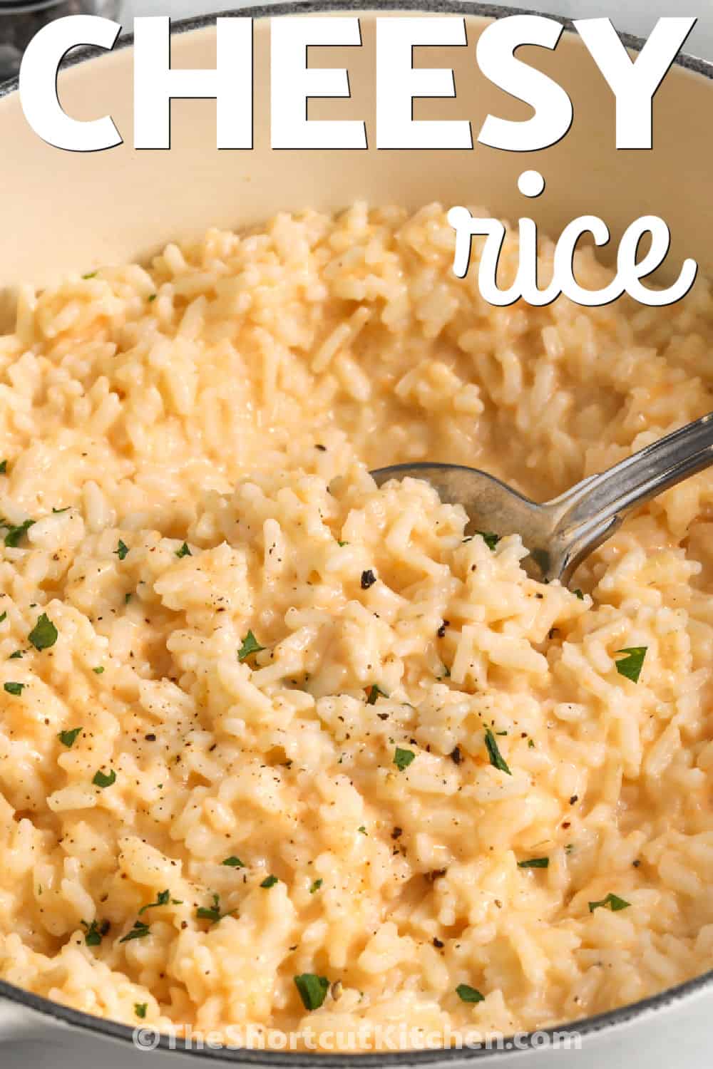 For weeknight meals, cheesy rice is always welcome at the table. This creamy rice recipe uses pantry staples, and cheddar brings plenty of flavor to every bite. Serve it with baked chicken, roast beef, or pork tenderloin for an easy family dinner. It is a comforting side dish that works for holidays and everyday meals alike. Everyone will be asking for seconds when this recipe is served. Try this cheesy rice recipe today. #theshortcutkitchen creamy Cheesy Rice with a title