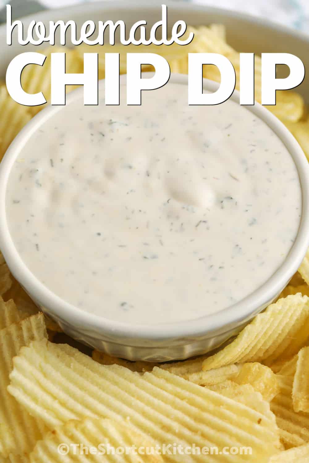 Homemade chip dip is the easy cold party dip to keep on hand for chips and vegetables. Sour cream and mayonnaise make it rich and creamy, while dill, parsley, and garlic powder add classic savory flavor. This homemade dip for chips is made in one bowl with pantry ingredients and can be prepped ahead so it is ready for snack trays, potlucks, and casual gatherings. Pin it for your next party. #theshortcutkitchen Homemade Chip Dip with chips and a title