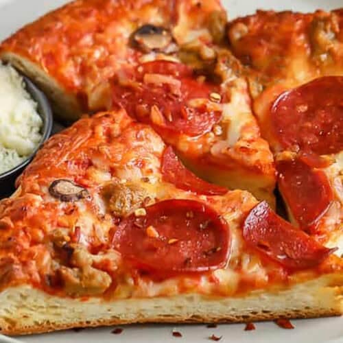 close up of hot cheesy pizza to show How to Reheat Pizza in the Air Fryer