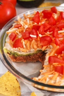 close up of 5 Layer Dip with a portion taken out to show all the layers