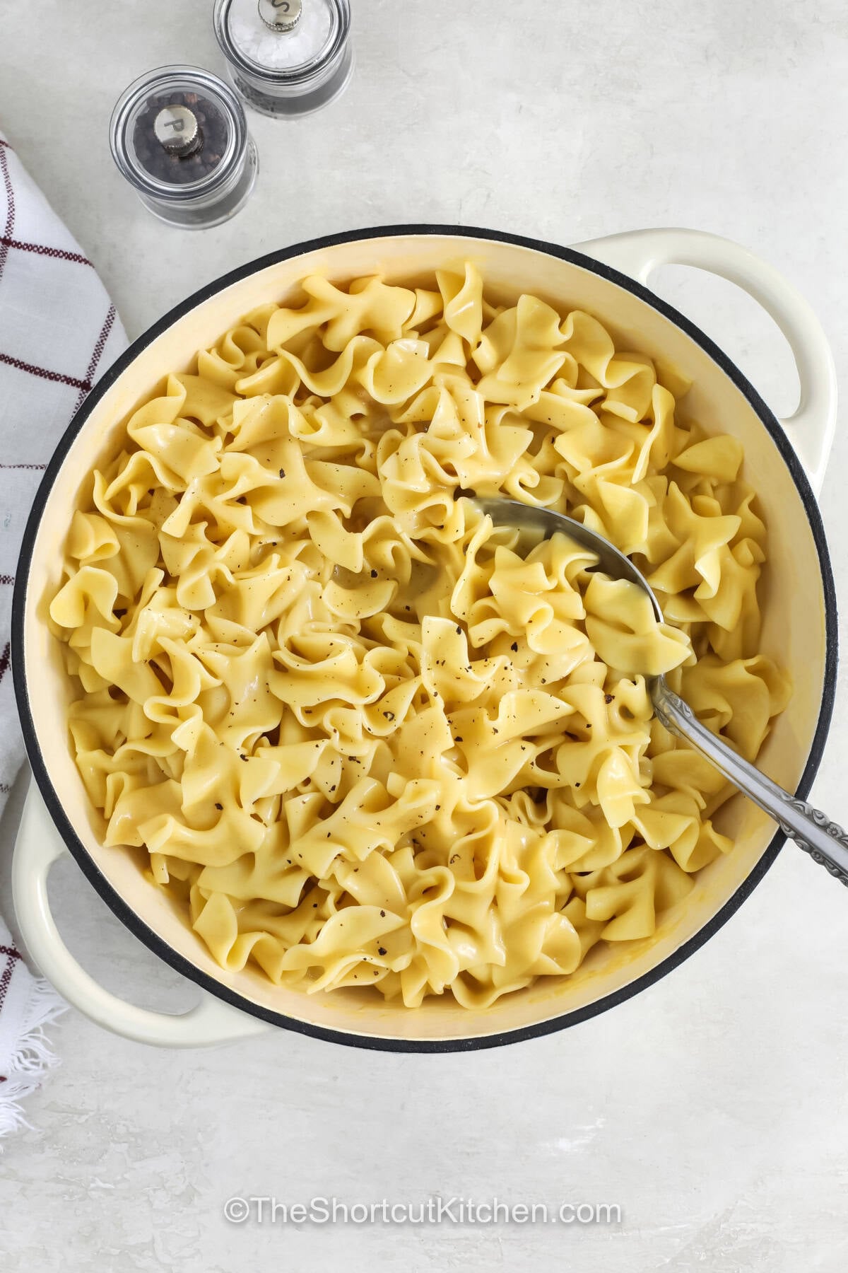 Classic cafeteria noodles are filled with creamy flavor and buttery goodness in every bite. This easy noodle side dish is made with simple ingredients but delivers the kind of homemade taste that makes meals feel special. Pair it with chicken, turkey, pork, or meatloaf for a delicious dinner combination. Give this comforting recipe a try and enjoy a side dish everyone will love. #theshortcutkitchen pot of Cafeteria Noodles