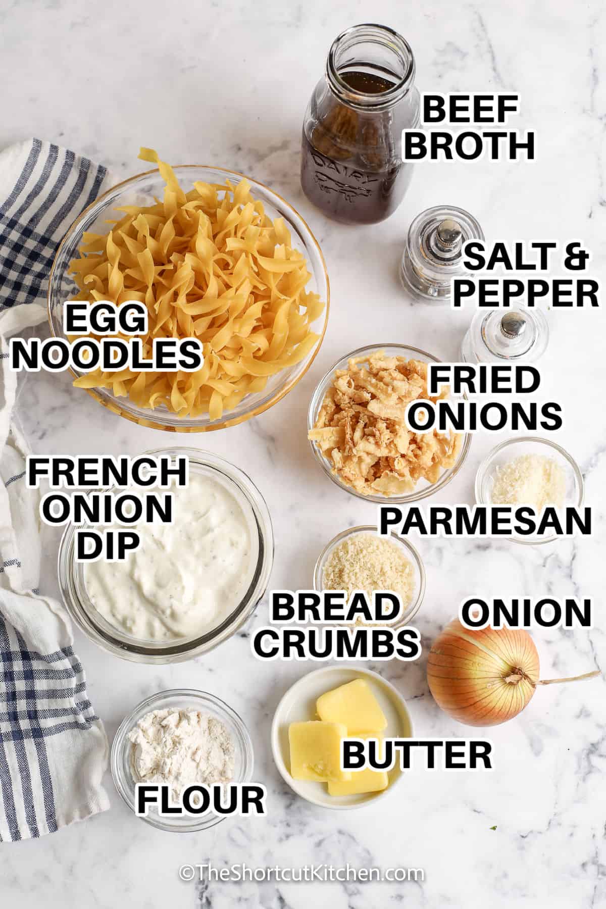 French onion casserole is a cozy oven-baked dinner made with tender egg noodles, sautéed onion, beef broth, and creamy French onion dip. A buttery topping of French fried onions, Panko breadcrumbs, and Parmesan bakes until crisp and golden. This easy French onion noodle casserole takes only 40 minutes and works as a meatless main dish or comforting side. Save this recipe for a busy weeknight dinner. #theshortcutkitchen beef broth , egg noodles , French onion dip , flour , butter , onion , bread crumbs , parmesan , fried onions , salt and pepper with labels to make French Onion Casserole