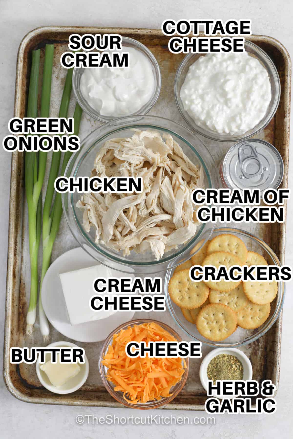 Million dollar chicken casserole makes ordinary chicken into an irresistible dinner everyone will request again. With a creamy cheese mixture, tender chicken, and a crunchy cracker topping, this casserole has layers of comforting flavor. It is simple to prepare and perfect for feeding a hungry family. Bring this easy chicken casserole to your table and enjoy every delicious bite. #theshortcutkitchen cottage cheese , sour cream , green onions , chicken , cream of chicken soup , crackers , cream cheese , butter , cheese , herb and garlic seasoning with labels to make Million Dollar Chicken Casserole
