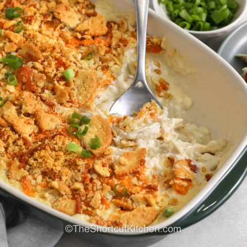 creamy Million Dollar Chicken Casserole with a spoon