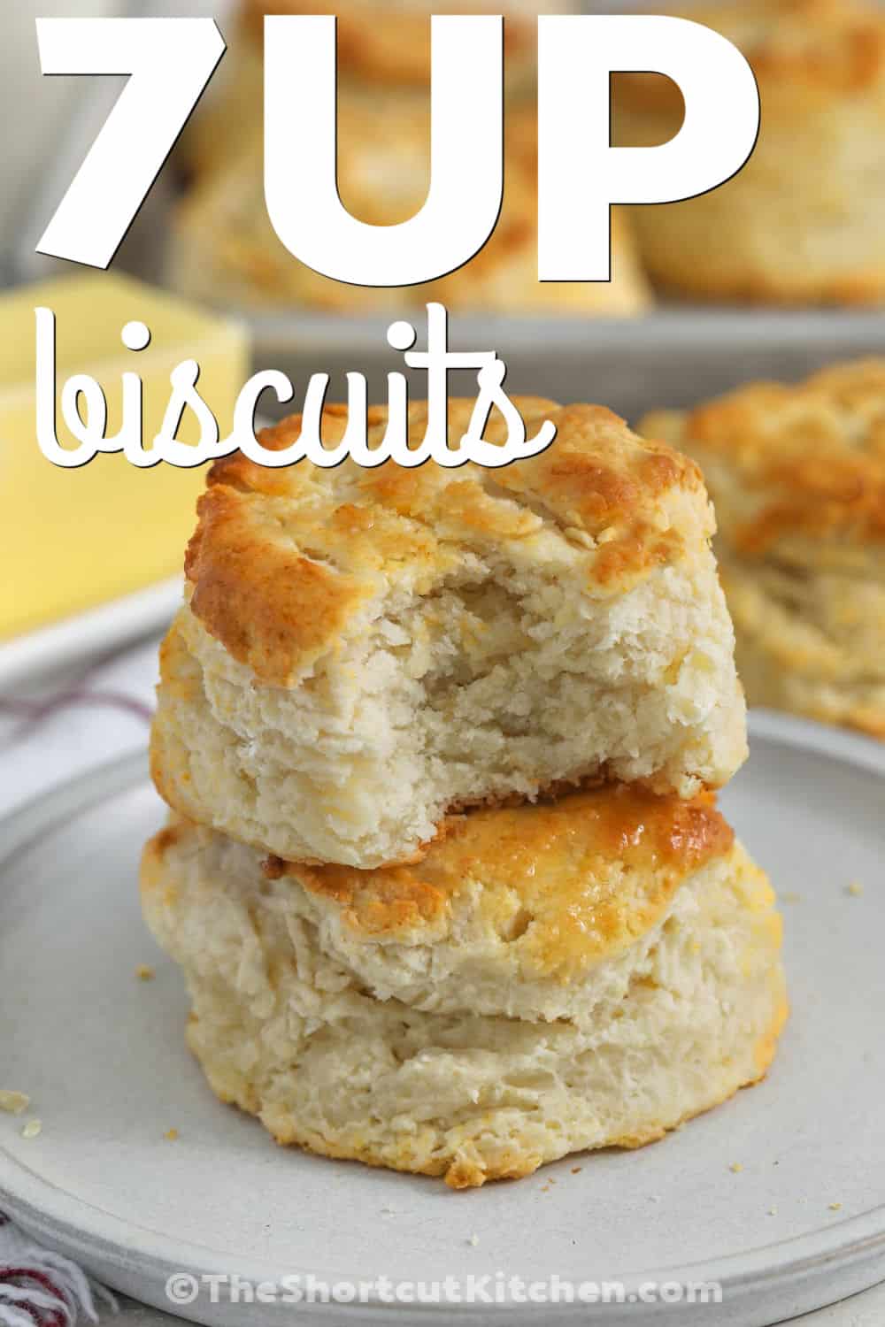 For a quick homemade side, 7up biscuits are hard to beat. Bisquick makes the dough simple, while sour cream and butter add rich flavor and a light texture. Lemon-lime soda helps these easy biscuits bake up beautifully without a long list of ingredients. Enjoy them warm with butter, jam, soup, chili, or sausage gravy. This easy biscuit recipe is one you will want to keep close. Try 7up biscuits for your next family meal. #theshortcutkitchen 7up Biscuits with a bite taken out of one with a title