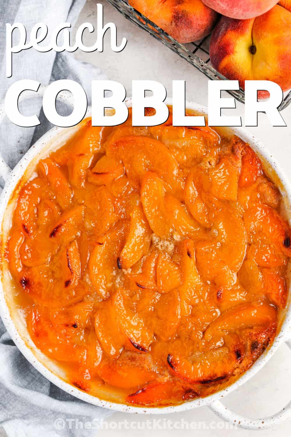 Make Bisquick peach cobbler with canned peaches for a shortcut dessert that tastes warm, sweet, and homemade. This easy Bisquick cobbler uses pantry staples and bakes in one dish with a cinnamon butter batter and juicy peach topping. It is perfect for potlucks, Sunday dinner, holidays, or a quick weeknight dessert with ice cream. Pin this recipe to make when peaches are calling. #theshortcutkitchen dish of baked Bisquick Peach Cobbler with a title