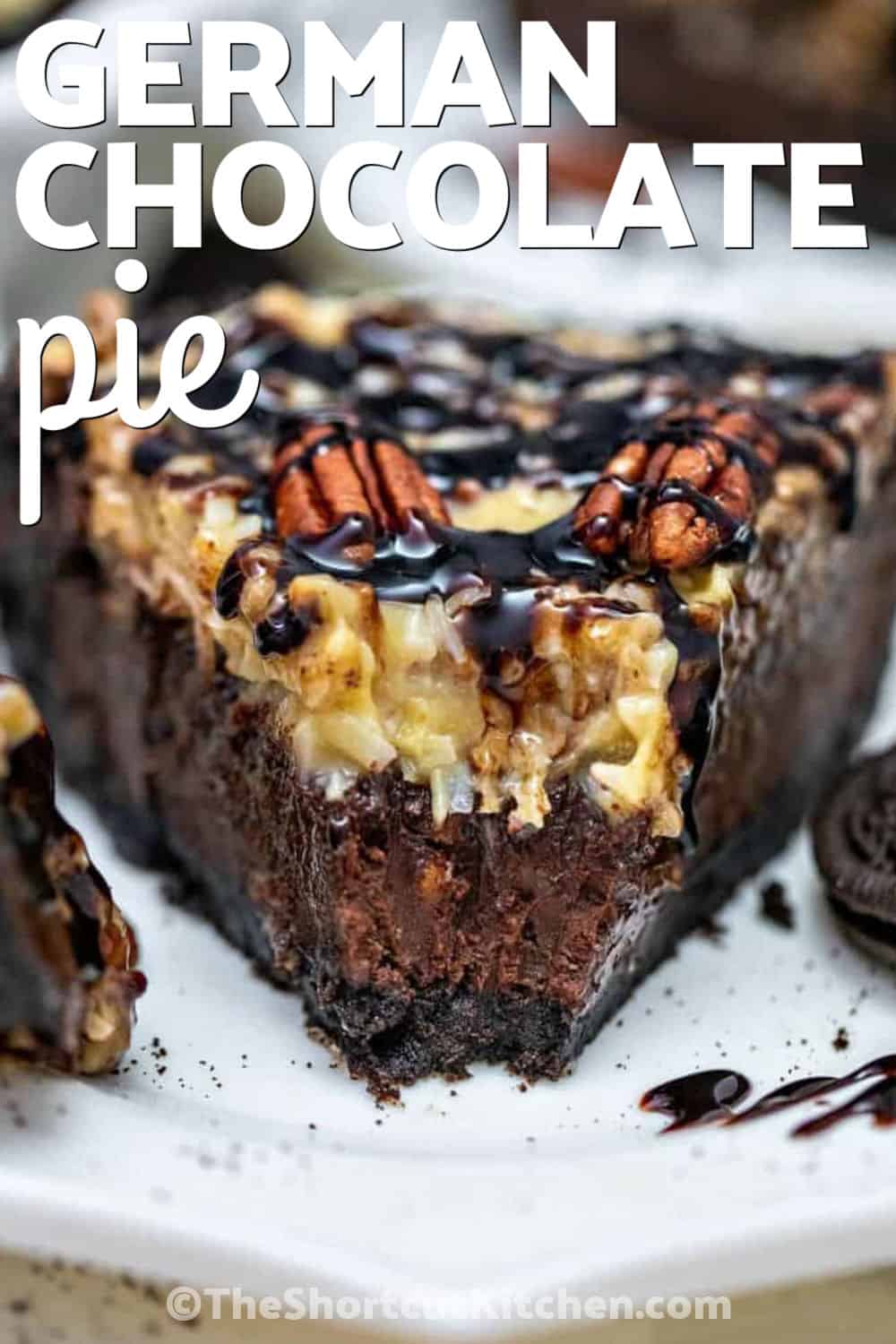 This German chocolate pie has a chilled Oreo crust, smooth cocoa chocolate filling, chopped pecans, and a thick coconut pecan topping made with sweetened condensed milk. It is a rich make-ahead dessert with classic German chocolate cake flavor baked into an easy pie recipe. Pin this recipe for later. #theshortcutkitchen slice up of German Chocolate Pie with pecans and a title