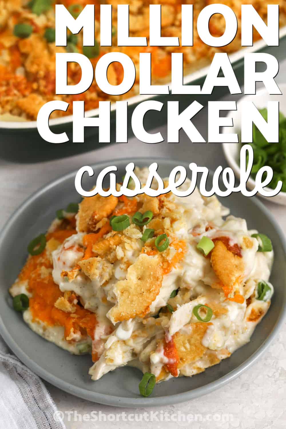 Million dollar chicken casserole is the ultimate comfort food for family dinners. Creamy chicken, rich cheese, and a buttery Ritz cracker topping come together in a cozy baked casserole everyone will enjoy. Rotisserie chicken makes this recipe simple while still delivering homemade flavor. Add this cheesy chicken casserole to your meal plan and make it for your next comforting dinner. #theshortcutkitchen close up of plated Million Dollar Chicken Casserole with a title