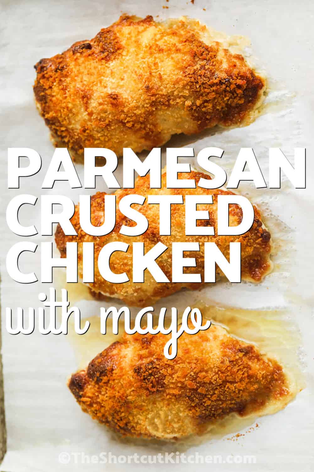 Parmesan crusted chicken with mayo is a simple baked chicken breast recipe with a ranch Parmesan topping and crisp panko finish. This chicken with mayo is easy enough for weeknights but flavorful enough for company. The oven-baked method keeps cleanup easy, and leftovers are delicious in sandwiches, wraps, salads, or pasta dishes the next day. Pin this chicken recipe to make this week. #theshortcutkitchen Parmesan Crusted Chicken with Mayo on a sheet pan with a title