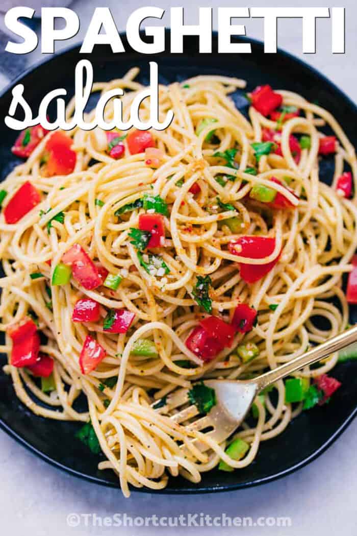 plated Spaghetti Salad with a fork and a title
