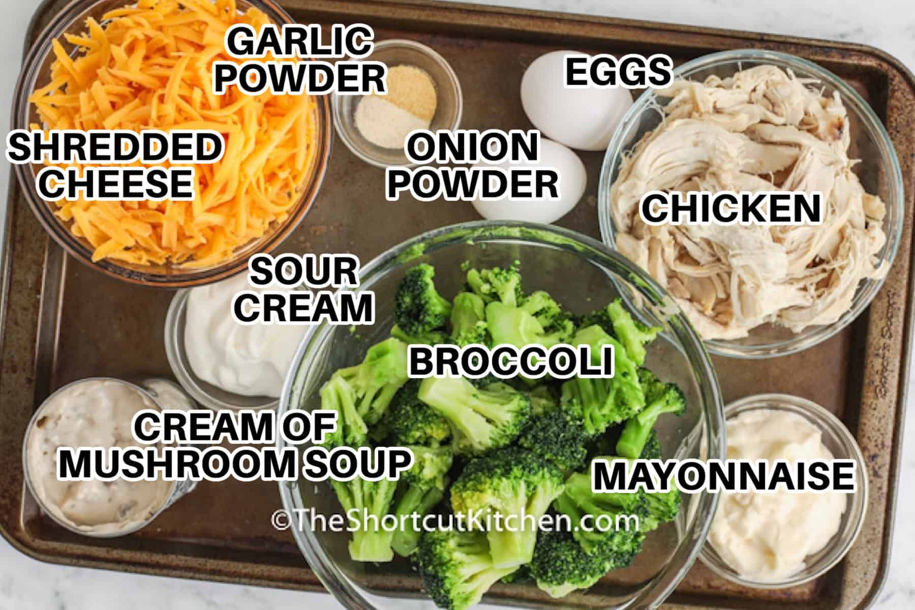 Broccoli chicken casserole is an easy oven-baked dinner made with frozen broccoli, cooked chicken, cheddar cheese, sour cream, mayonnaise, and creamy mushroom soup. Everything mixes in one bowl before baking under a golden layer of melted cheese. Use leftover or rotisserie chicken to keep preparation fast and serve this creamy chicken and broccoli casserole with rice, biscuits, or salad. Save this easy casserole for dinner. #theshortcutkitchen