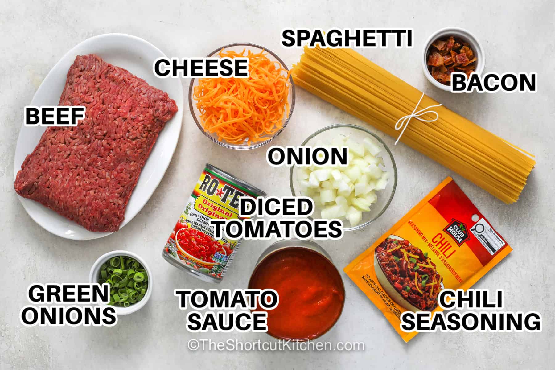 Make cowboy spaghetti when you want a hearty dinner with plenty of flavor and simple ingredients. Ground beef and onion simmer with tomato sauce, diced tomatoes, and chili seasoning for a tasty pasta sauce. Finish each bowl with cheddar, bacon bits, and green onions for a delicious touch. Add this easy recipe to your menu. #theshortcutkitchen beef , cheese , spaghetti , bacon , onion , diced tomatoes , tomato sauce , chili seasoning , green onions with labels to make Cowboy Spaghetti