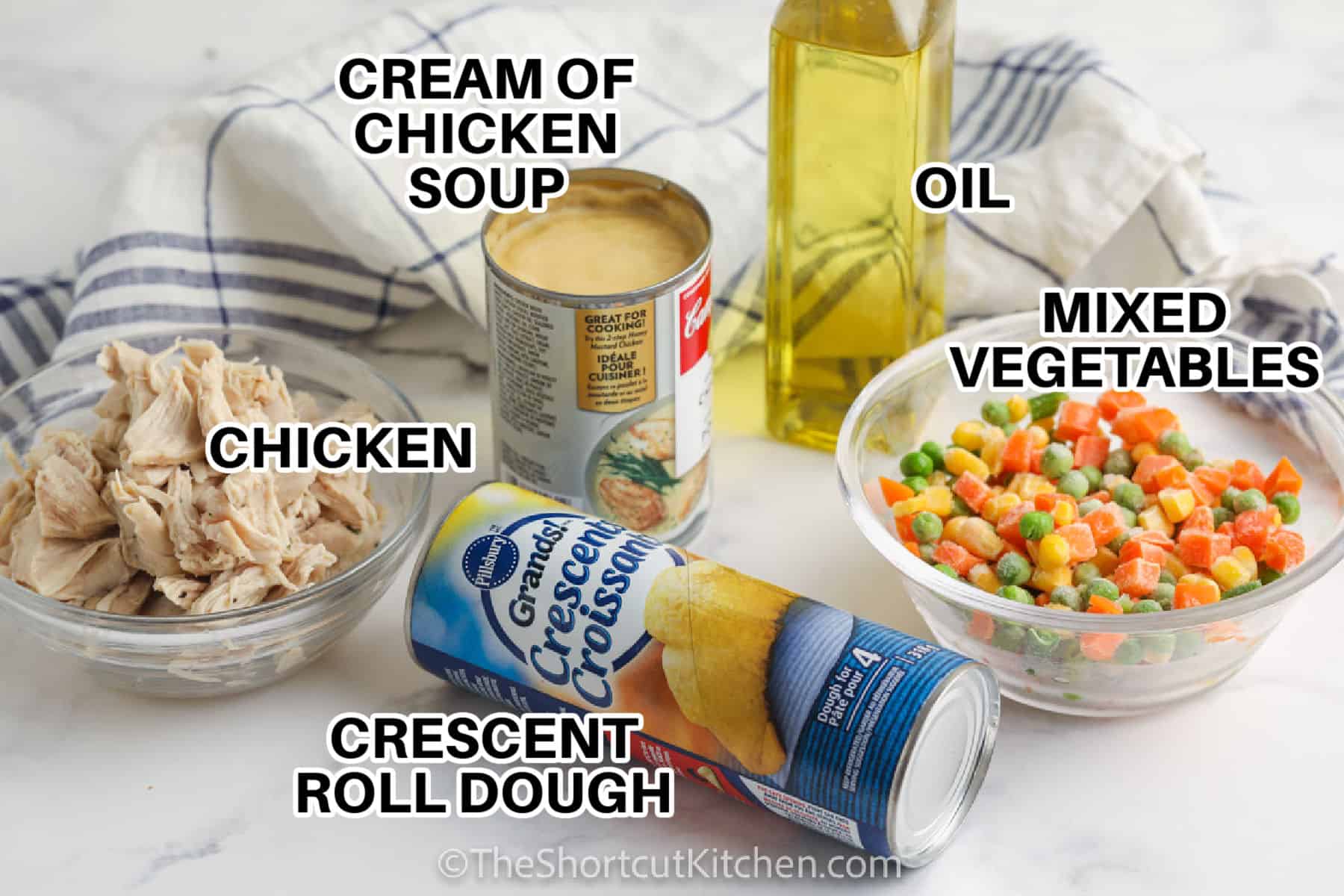 cream of chicken soup , chicken , crescent roll dough , oil and mixed vegetables with labels to make Mini Chicken Pot Pies