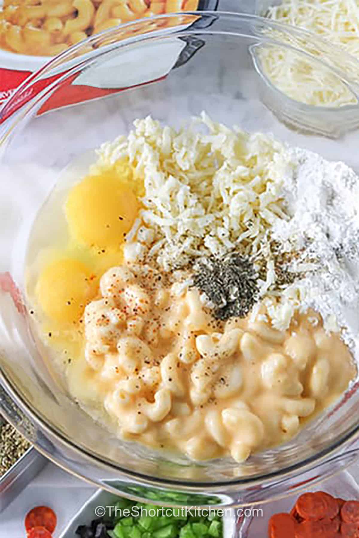 adding macaroni and cheese with eggs and seasonings to make Mac and Cheese Pizza Bites