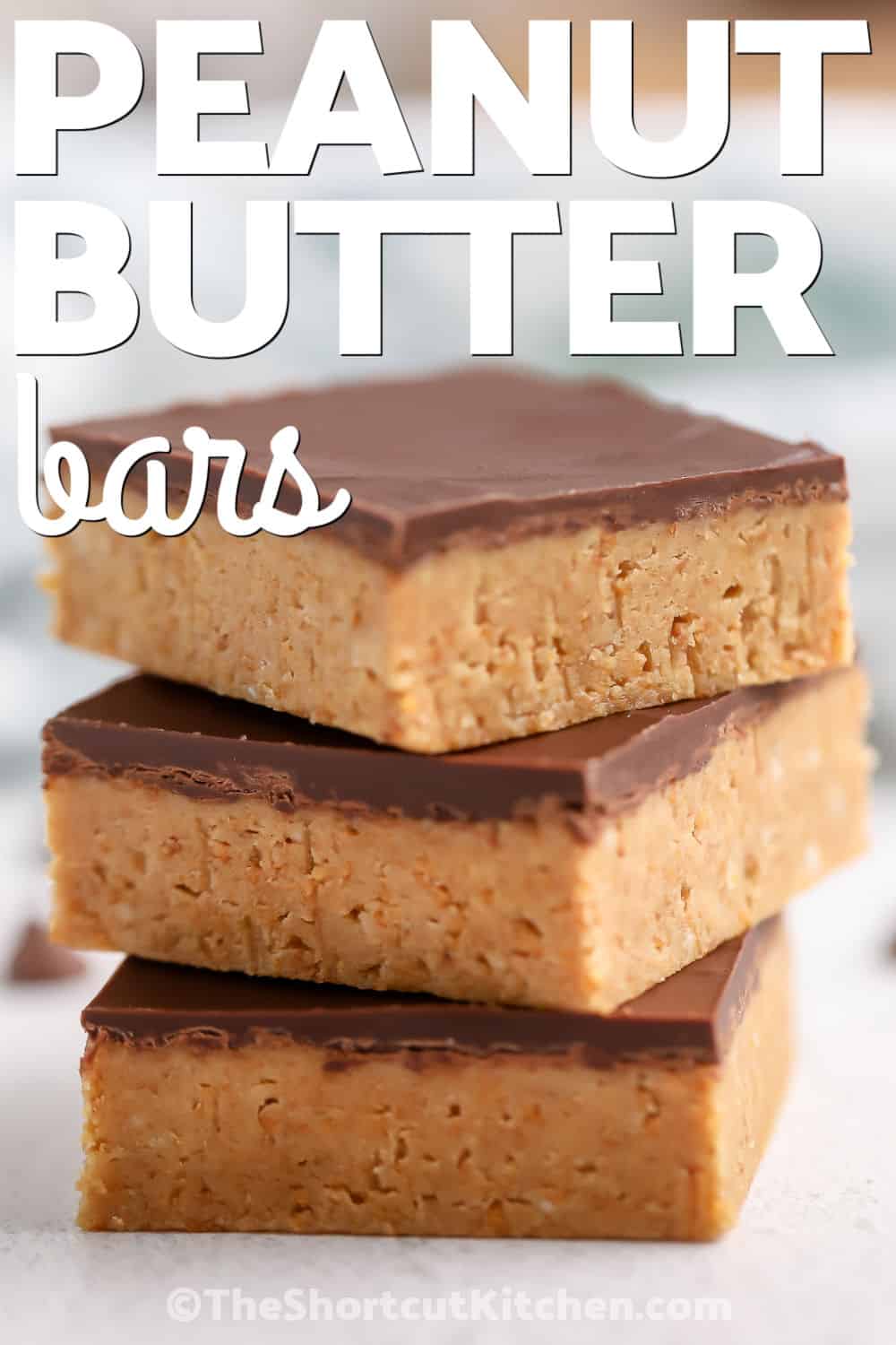 Looking for the best peanut butter bars recipe? These easy no-bake bars are made with pantry staples and topped with rich chocolate for a dessert everyone loves. Sometimes called a Gold Bars Recipe, they're quick to prepare, easy to freeze, and ideal for holiday baking or anytime cravings. Pin this recipe for later. #theshortcutkitchen stack of Peanut Butter Bars with a title