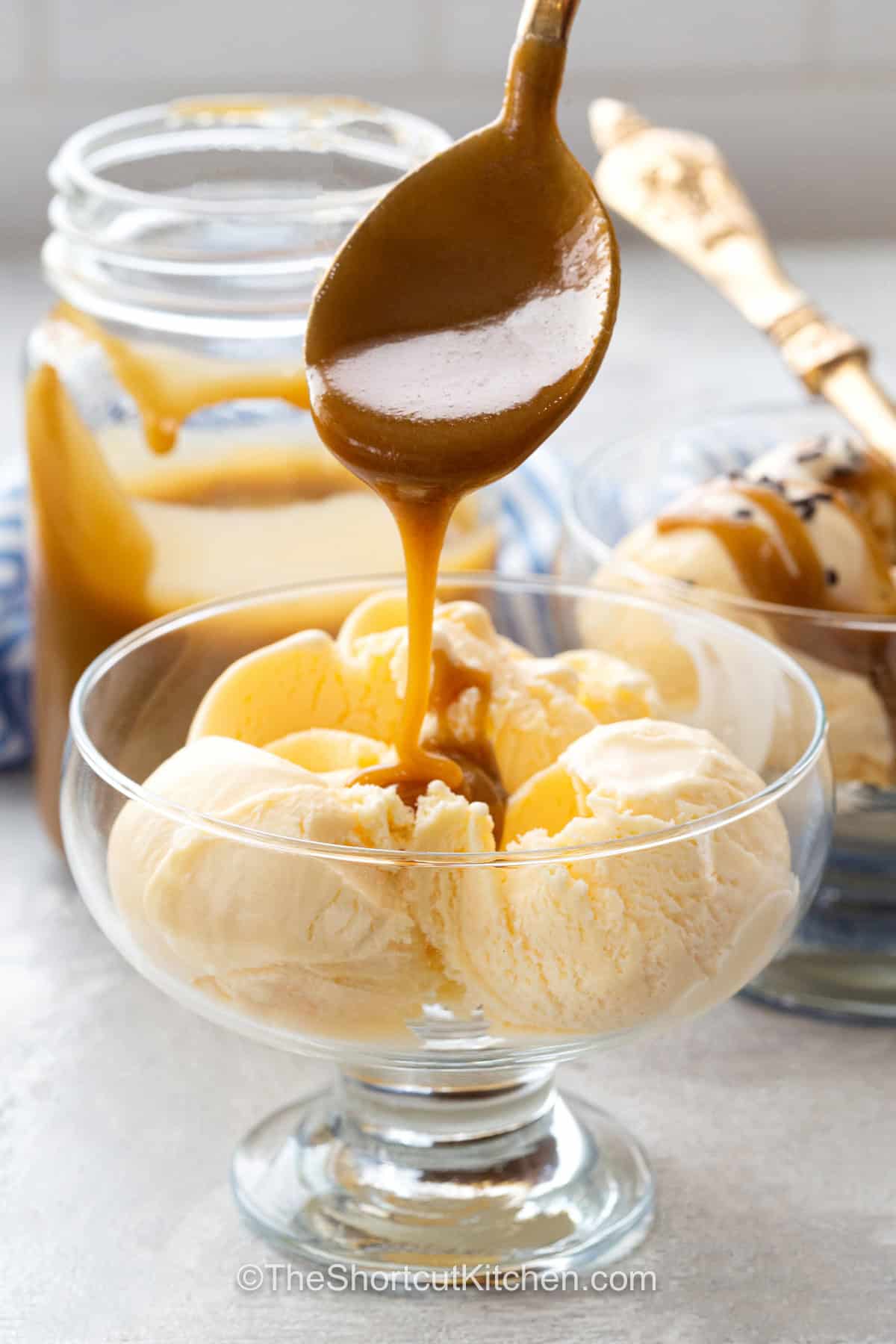 Easy caramel sauce is the quick homemade dessert topping to keep on repeat. Butter, brown sugar, and milk cook together on the stovetop until smooth, glossy, and deliciously rich. This 3 ingredient caramel sauce skips complicated candy-making techniques and tastes wonderful warm over vanilla ice cream, apple desserts, brownies, pancakes, or waffles. Save this easy caramel sauce recipe for dessert night. #theshortcutkitchen ice cream with Easy Caramel Sauce.