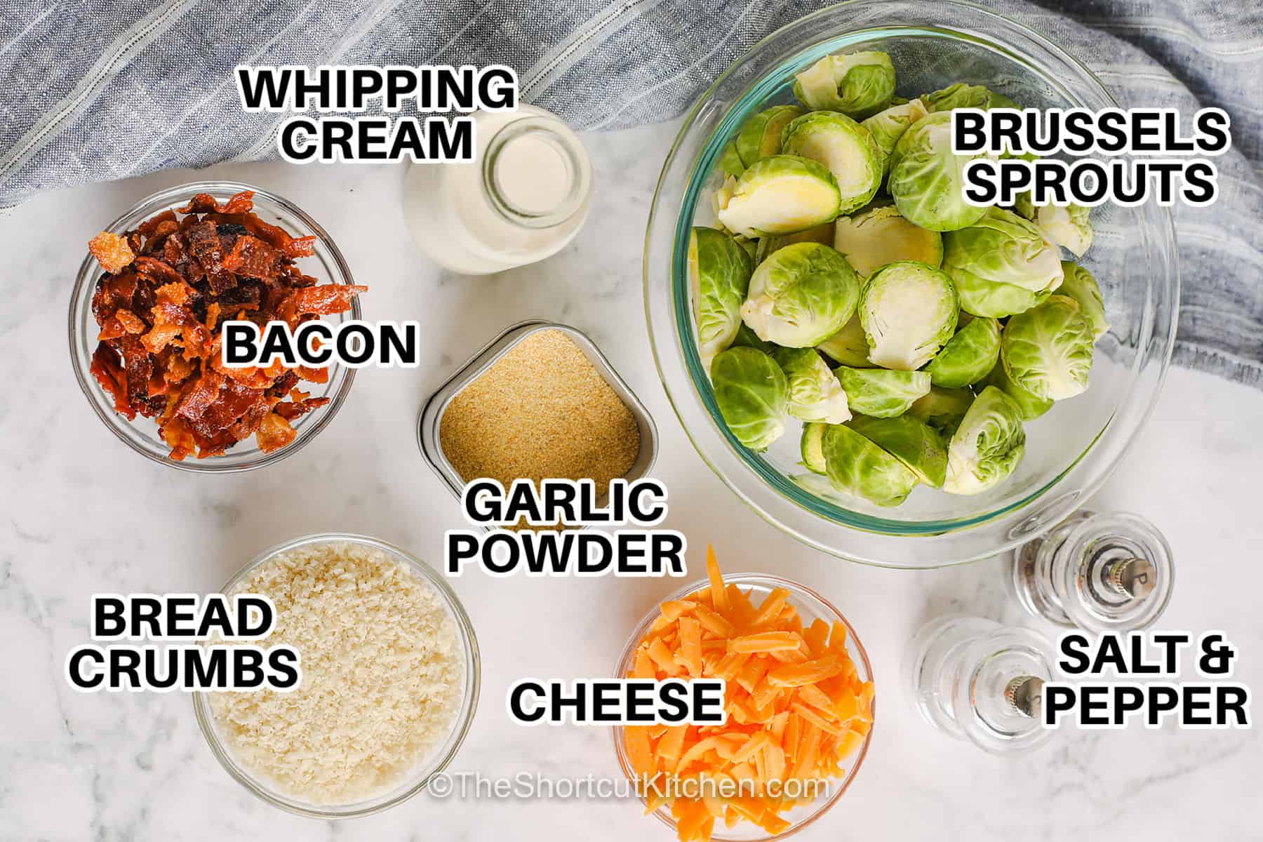 Brussel sprout casserole turns fresh Brussels sprouts into an easy comfort-food side with smoky bacon, rich heavy cream, melted cheddar cheese, and crispy panko. The sprouts are quickly cooked until tender, mixed with the creamy filling, and baked until golden and bubbly. This easy Brussels sprout casserole is ready in 30 minutes and fits weeknight dinners or holiday menus. Save this easy casserole recipe for dinner. #theshortcutkitchen whipping cream, bacon, garlic powder , bread crumbs , cheese , Brussels sprouts , salt and pepper with labels to make Brussel Sprout Casserole.