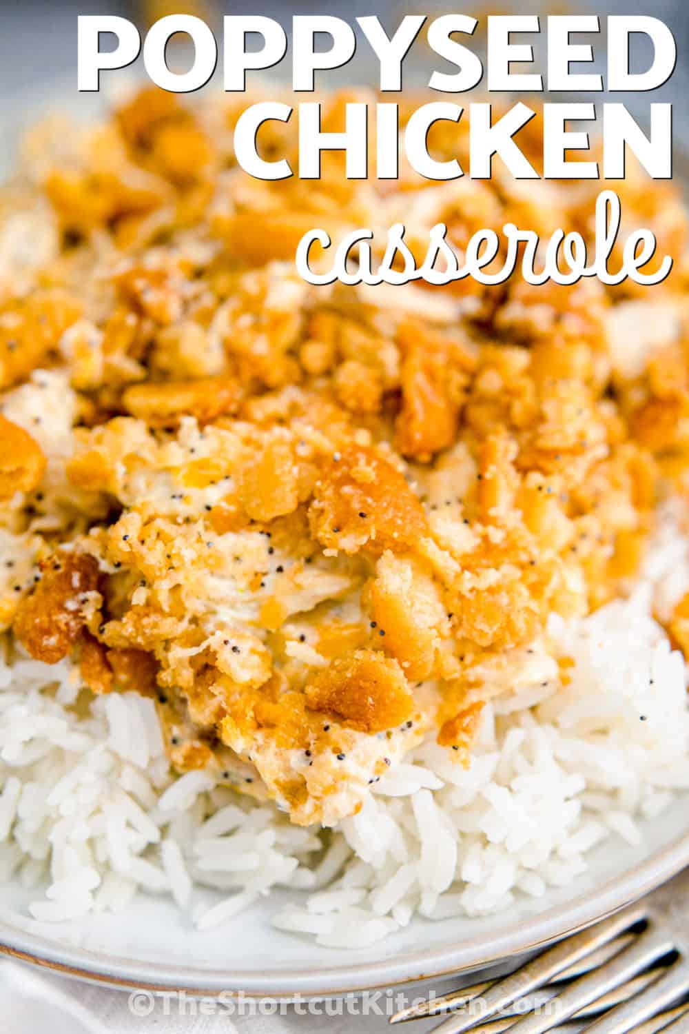 Make chicken poppyseed casserole when comfort food needs to be quick and easy. Cooked chicken is mixed with cream of chicken soup, Greek yogurt, cheddar, mozzarella, lemon, and seasonings, then topped with buttery Ritz crackers. This creamy chicken casserole goes from prep to table in only 40 minutes and is perfect for leftover or rotisserie chicken. Pin this easy chicken casserole for your next busy weeknight. #theshortcutkitchen Chicken Poppyseed Casserole on rice with a title.