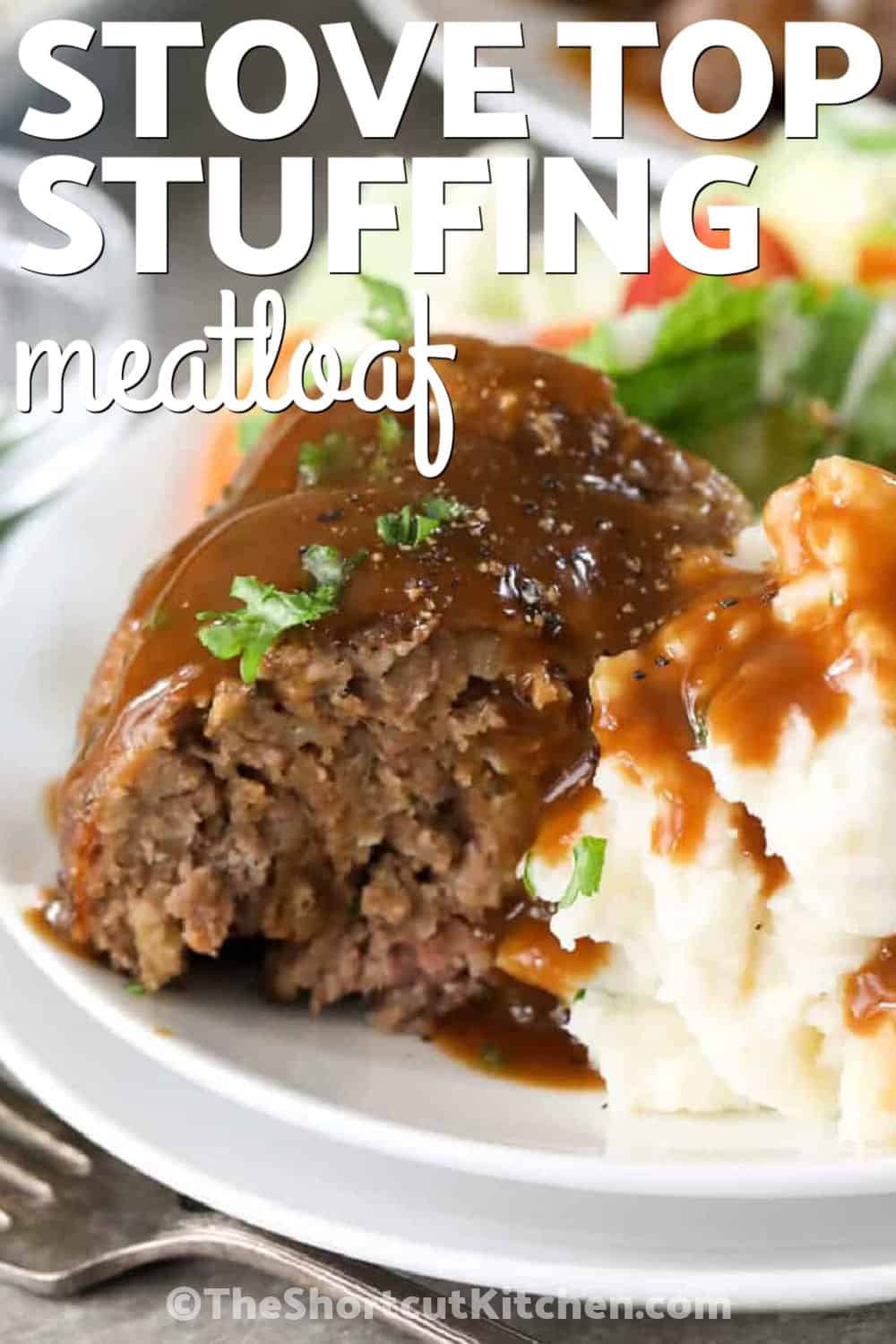 stove top stuffing meatloaf on a white plate with mashe dpotatoes and gravy and a title.