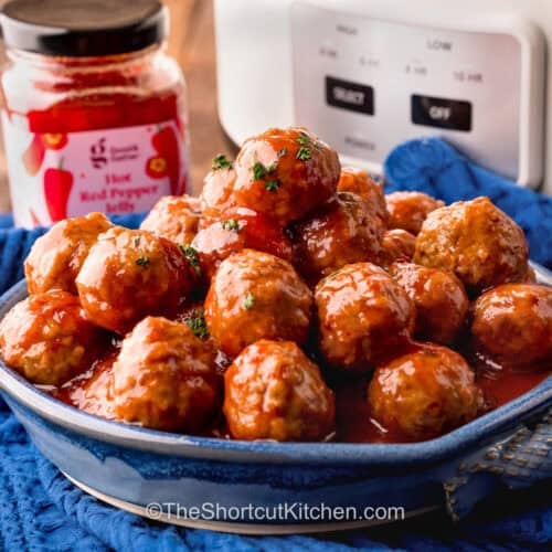 bowl of Pepper Jelly Meatballs with hot red pepper jelly.