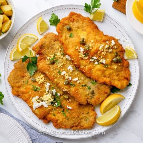 Pork Schnitzel Recipe with lemon slices.